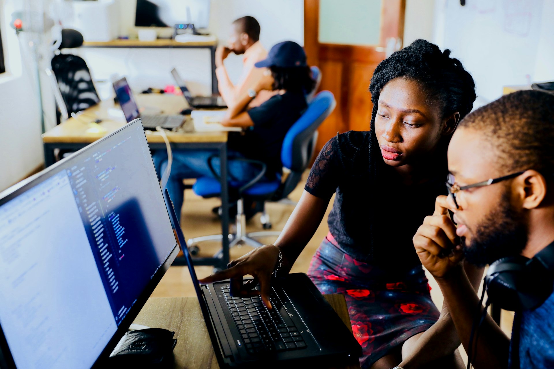 Team using AI tools on screens